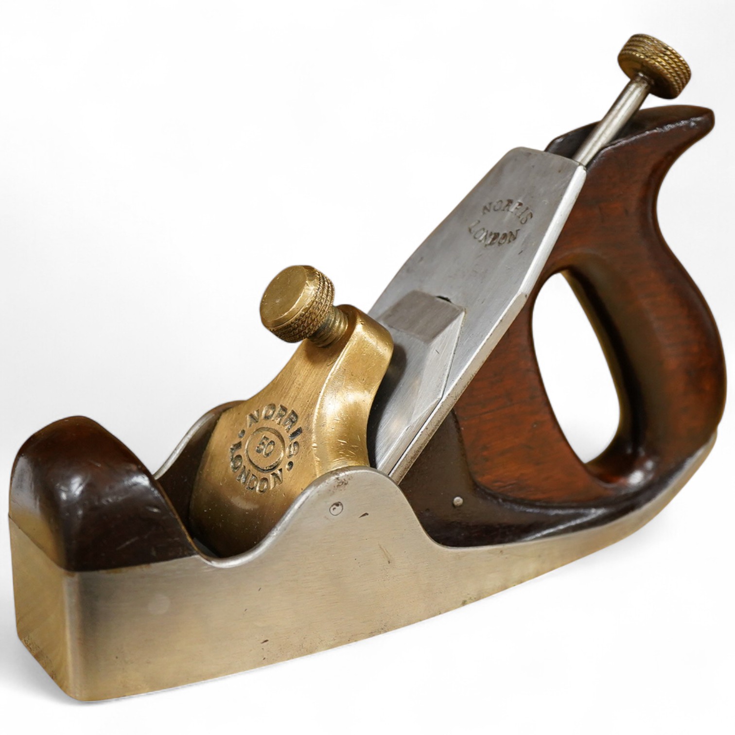 A Norris No.50 adjustable smoothing plane, stamped with Norris, London to both the brass lever cap and the iron, with owner’s name stamped to the handle